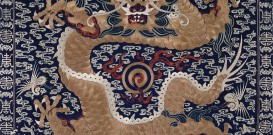 Blue ground metal thread embroidered textile with a dragon and the pearl of flames.